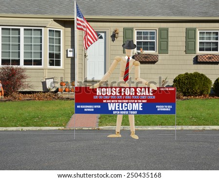 American flag pole mannequin holding Real estate for sale open house welcome sign closeup view Suburban home landscaped lawn sunny residential neighborhood autumn day USA