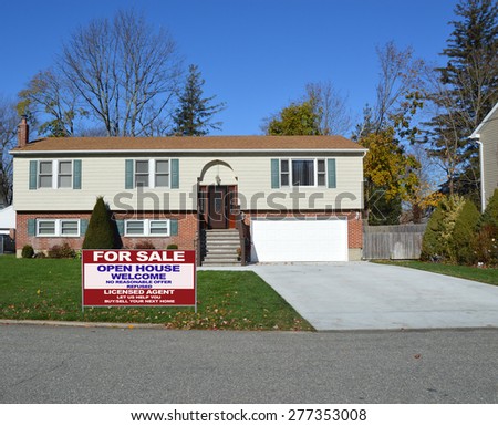 Real estate for sale open house welcome sign Beautiful Suburban High Ranch Brownstone Brick Siding Home Residential Neighborhood Clear blue sky USA