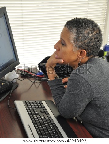 African American woman working at computer
