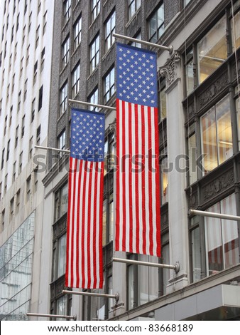 Two American Flags Hanging on side of Building in Manhattan New York