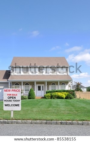 Real Estate Welcome Sign on Front Yard Lawn of Two Story Cape Cod Suburban Home under Blue Sky Residential Neighborhood