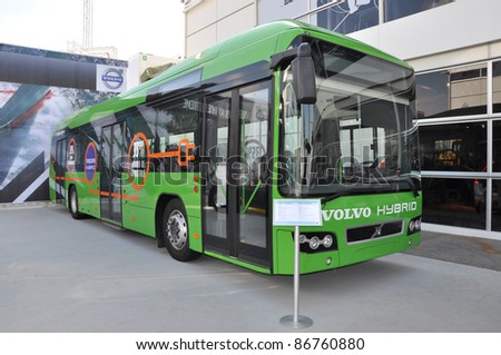 ALICANTE, SPAIN - OCT 16: New green hybrid bus manufactured by Volvo, a Swedish company, on display at 2011-2012 Volvo Ocean Race village in costa blanca, Alicante. Oct 16, 2011.