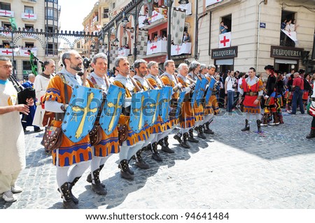 ALCOY, SPAIN - MAY 14: Men dressed as Christian legion marching in annual Moros y Cristianos parade commemorating 15th century battles between Moors and Christians in Spain. Alcoy May 14, 2011