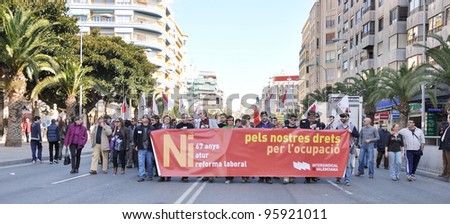 ALICANTE, SPAIN - FEB 19: Syndicatos organized a demonstration to protest job losses and financial cuts by Political Party politicians. Thousands of people marched in downtown Alicante Feb 19, 2012.