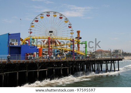 SANTA MONICA, CALIFORNIA - JUL 18: Santa Monica pier Pacific Park oceanfront amusement park\'s ferris wheel is the world\'s first and only solar powered Ferris wheel. Santa Monica Jul 18, 2009.