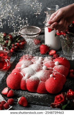 Similar – Image, Stock Photo Person pouring sugar powder with tea strainer above cake