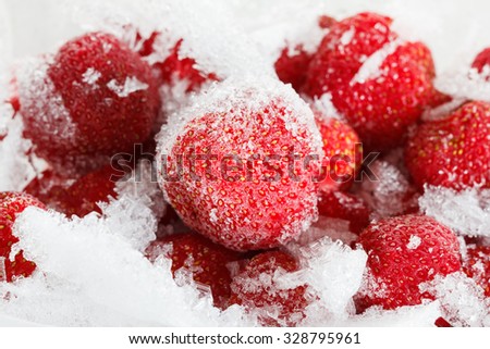 Strawberries, frozen for long term storage of ice and snow. It can be used as background