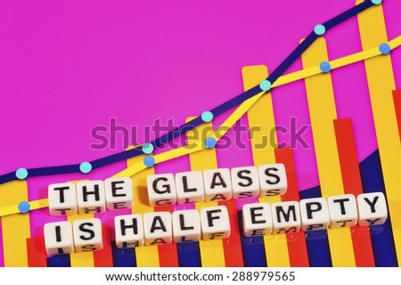 Business Term with Climbing Chart / Graph - The Glass Is Half Empty