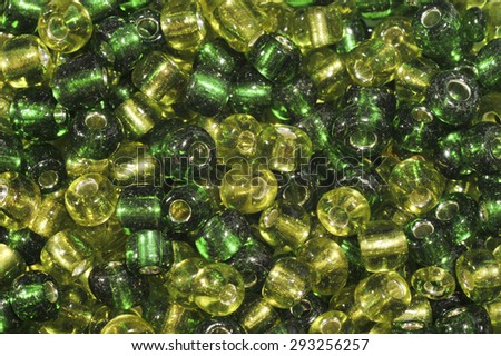 Transparent Beads Closeup - Yellow and Green beads on a white background