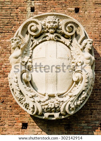 coat-of-arms of milan, sculpture from renaissance. symbol of the town hall