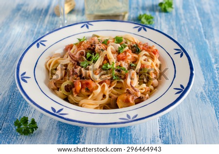 Italian pasta with seafood and tomato sauce