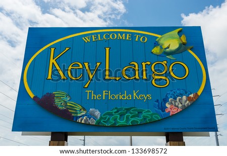 KEY LARGO, FL - CIRCA 2012: Welcome sign over the US1 in Key Largo circa 2012. The Florida Keys are a very popular tourist destination with over 2 million yearly visitors.