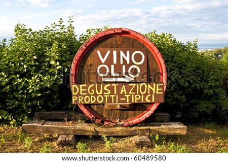 A wine and olive oil tasting sign in Tuscany, Italy. Taste tipical products.