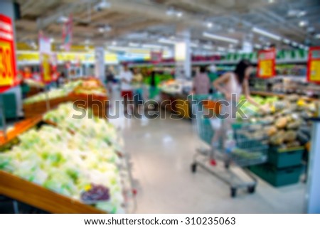 Shopping blur in the super market.
The corridor filled with fruits, vegetables and other products. And products on the shelves in supermarkets.