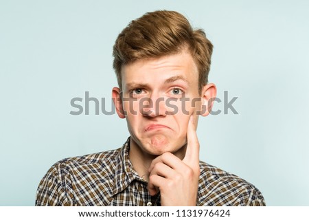 not bad. approval judgement. accepting man with raised eyebrow. portrait of a young guy on light background. emotion facial expression. feelings and people reaction. Сток-фото © 