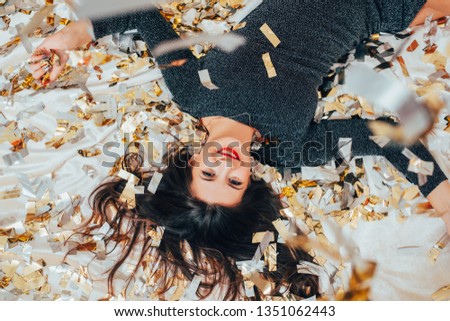 Similar – Image, Stock Photo Black woman scattering confetti on street