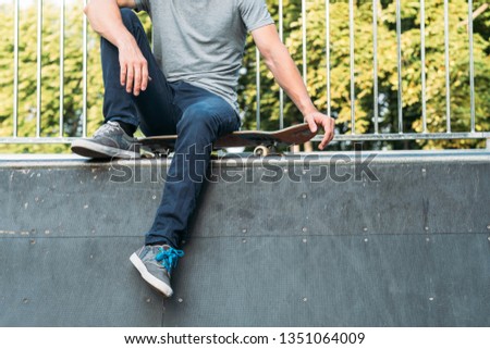 Similar – Image, Stock Photo Carefree male skater browsing cellphone in city