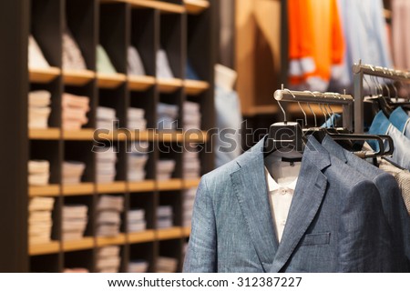Shop with fashionable business and casual men\'s wear in city shopping center. Jackets and business suits.