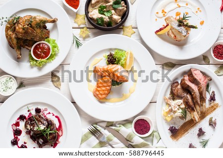 Fish and meat meals variety flat lay. Top view on buffet with assortment of  healthy hearty food. Buffet, banquet, appetizer, restaurant menu concept -  Stock Image - Everypixel