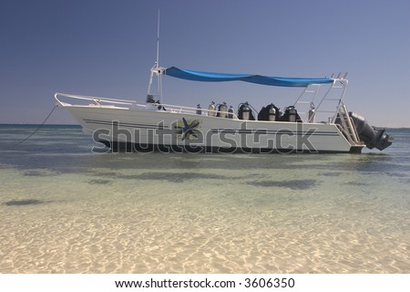 Dive boat over crystal clear waters