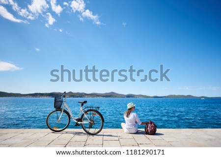 Similar – Image, Stock Photo Woman on stony seashore looking on foamy water washing peaks