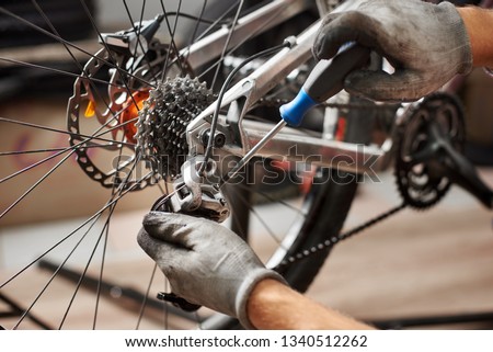 Similar – Foto Bild Crop Mechaniker Befestigung Fahrrad Rad mit Steckschlüssel