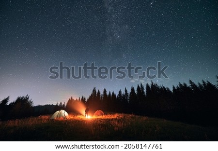 Similar – Image, Stock Photo Man standing under starry night