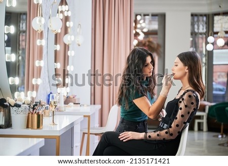 Image, Stock Photo Makeup artist doing makeup for young female artist