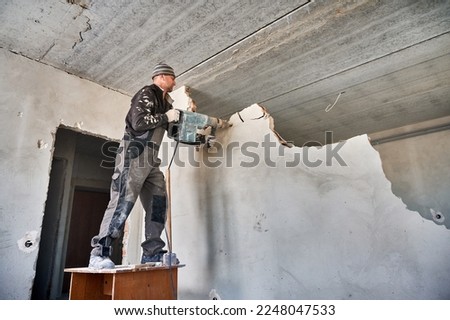 Similar – Image, Stock Photo Man worker drilling wall with hammer drill, top view