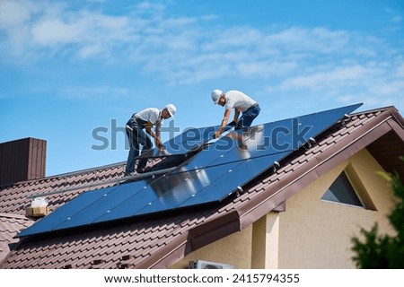 Similar – Image, Stock Photo Solar system on the roof with snow in winter. Remove snow from solar panels in winter. Remove snow photovoltaic system