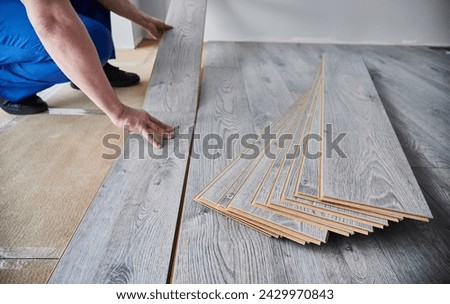 Similar – Image, Stock Photo Renovation concept. Male worker plastering a wall using a long spatula