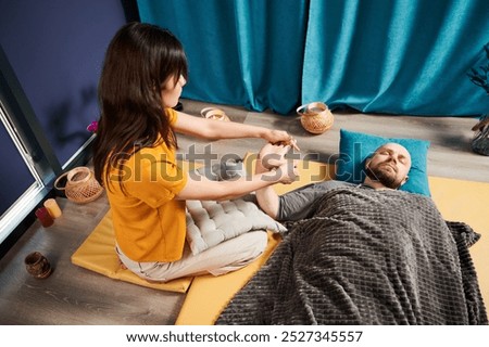 Similar – Image, Stock Photo Male therapist doing procedures with client in clinic