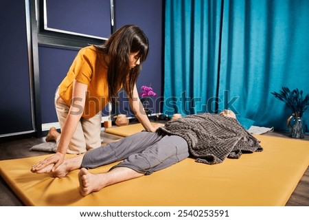 Similar – Image, Stock Photo Male therapist doing procedures with client in clinic