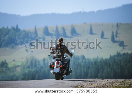 Similar – Image, Stock Photo Young long hair motorbike guy checking his phone while sitting on his old school motorbike during a break from the road route. Liberty life, young man heavy metal, white tshirt and gloves.