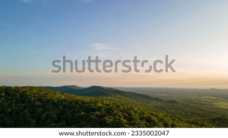 Similar – Foto Bild Luftaufnahme von Sonnenuntergang hellen Himmel über Sommer Heu Feld Landschaft am Abend. Haystack, Hay Roll in Sunrise Zeit