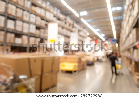 Blurred warehouse or storehouse background with some people