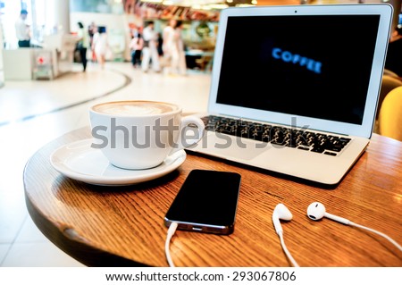 Working time with music in coffee shop and blurred background