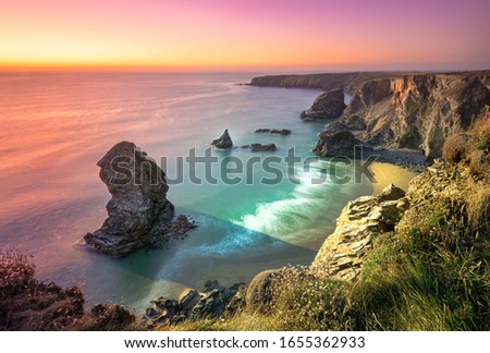 Sunset at Bedruthan Steps. Carnewas and Bedruthan Steps is a stretch of coastline located on the north Cornish coast between Padstow and Newquay, in Cornwall, England, United Kingdom