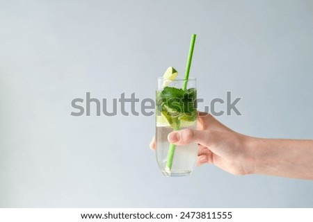 Similar – Image, Stock Photo Refreshing cocktail with lime and cucumber served on white table