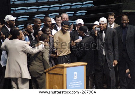 During the team welcome home ceremony at the Dean E. Smith Center, forward David Noel gets the 2005 NCAA National championship basketball North Carolina Tar Heels ready to sing a song to the crowd.