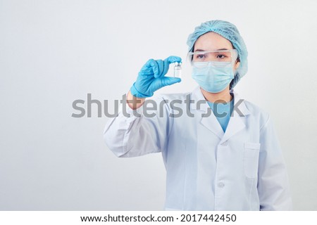 Similar – Image, Stock Photo female doctor holding covid-19 vaccine in hands