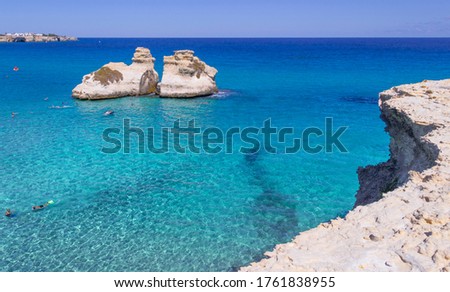 Similar – Image, Stock Photo The Two Sisters stacks in front of the shore of Torre dell’Orso