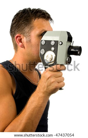 man is filming with old fashioned film camera over white background