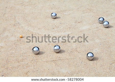 Game of jeu de boule, silvermetal  balls in sand. A french ball game