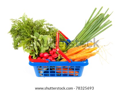 Shopping basket filled with healthy vegetables over white background