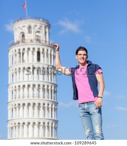Young Man Posing with Leaning Tower in Pisa