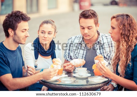 Group of Friends Having a Traditional Italian Breakfast