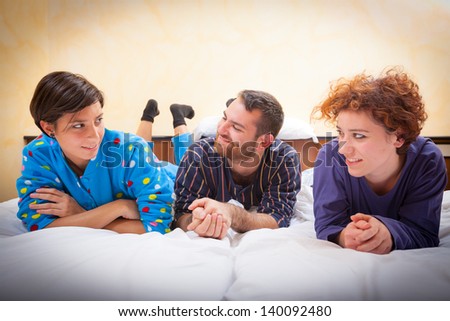 Man with Two Women on the Bed