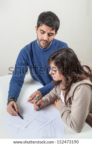 Young Woman Studying with Her Tutor