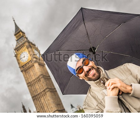 Man with Swim Cap, Goggles and Umbrella in London